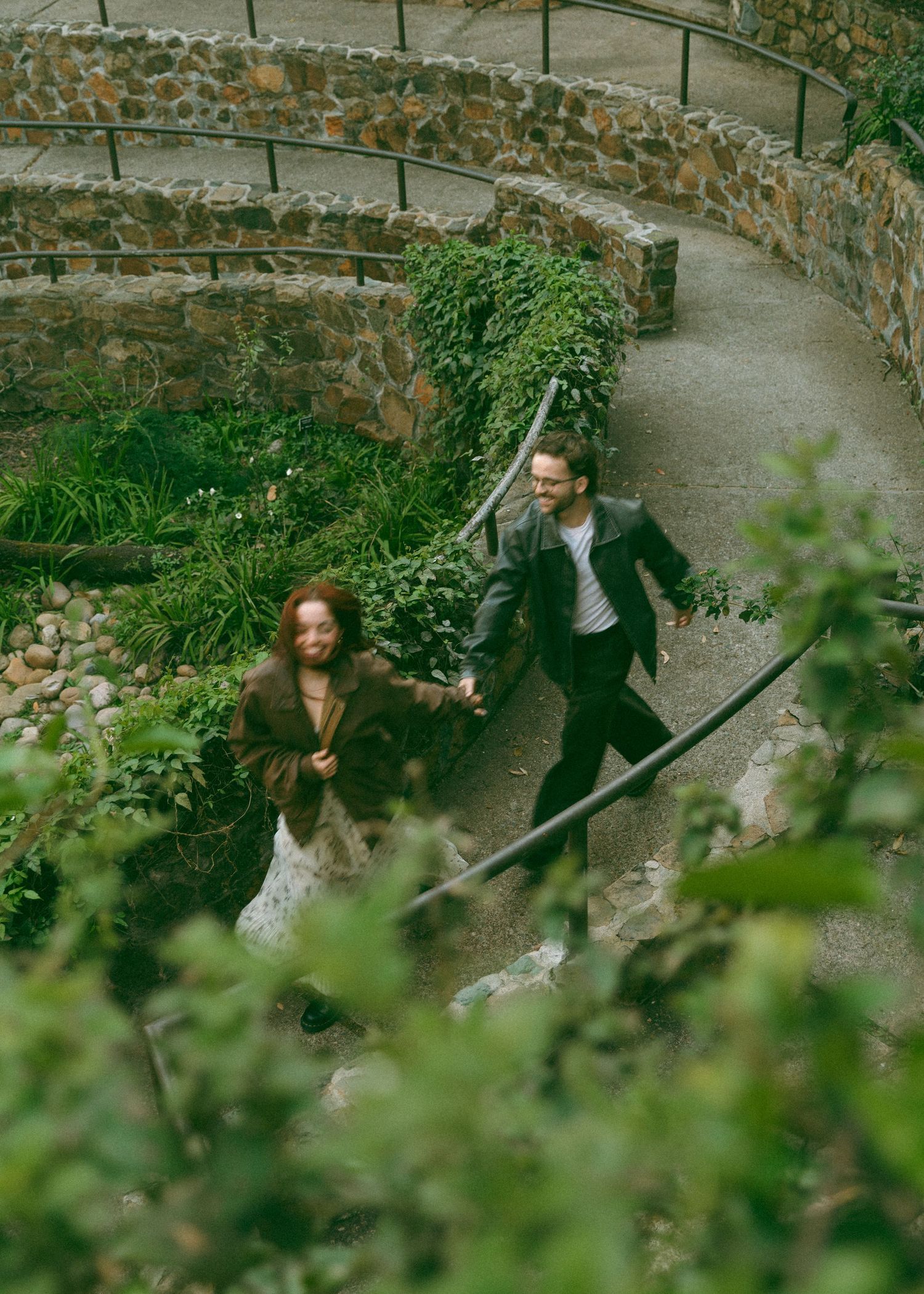 Series of photos taken along a stone path surrounded by lush greenery.