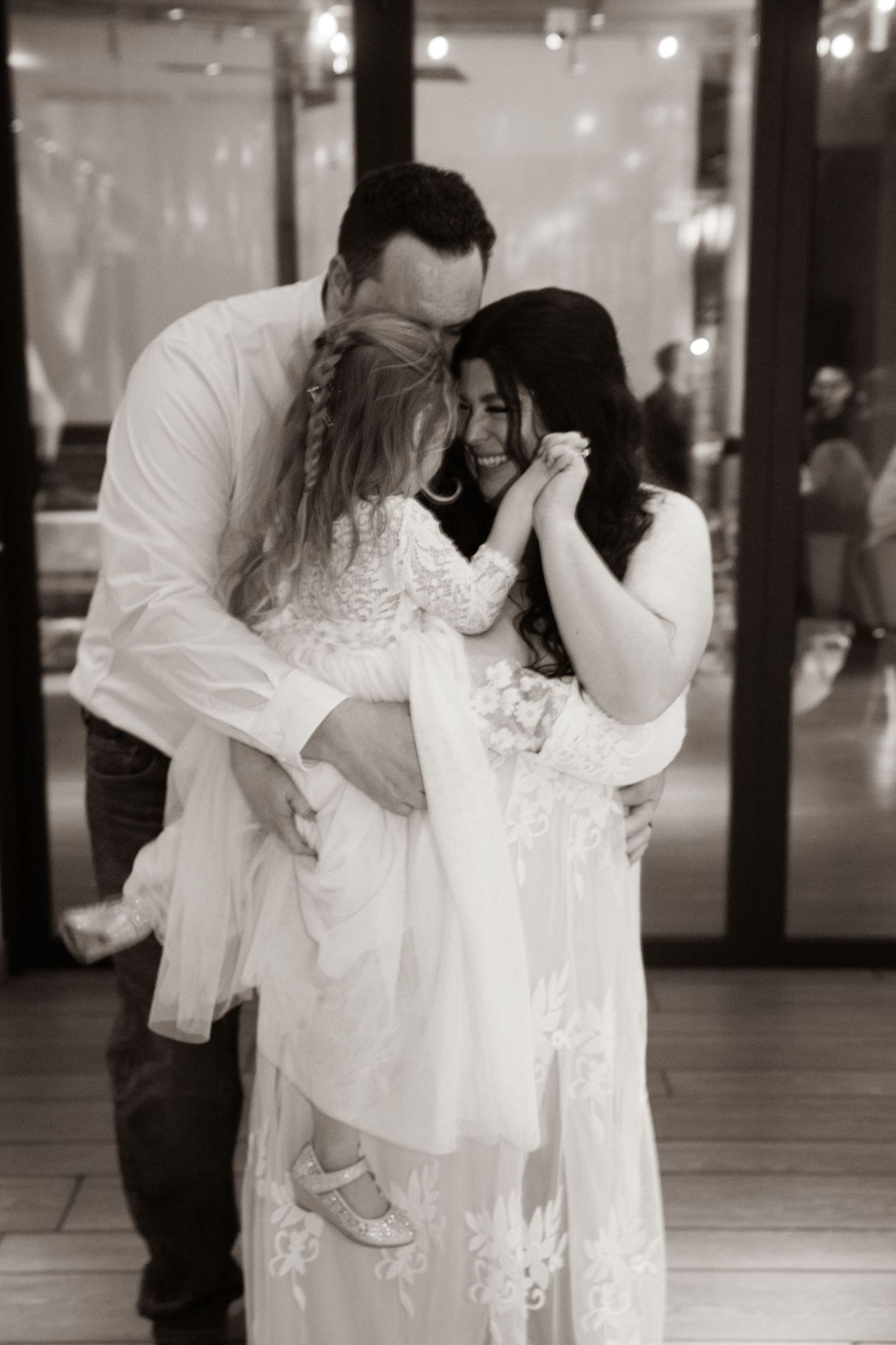 Black and white emotional moment captured during a special celebration.