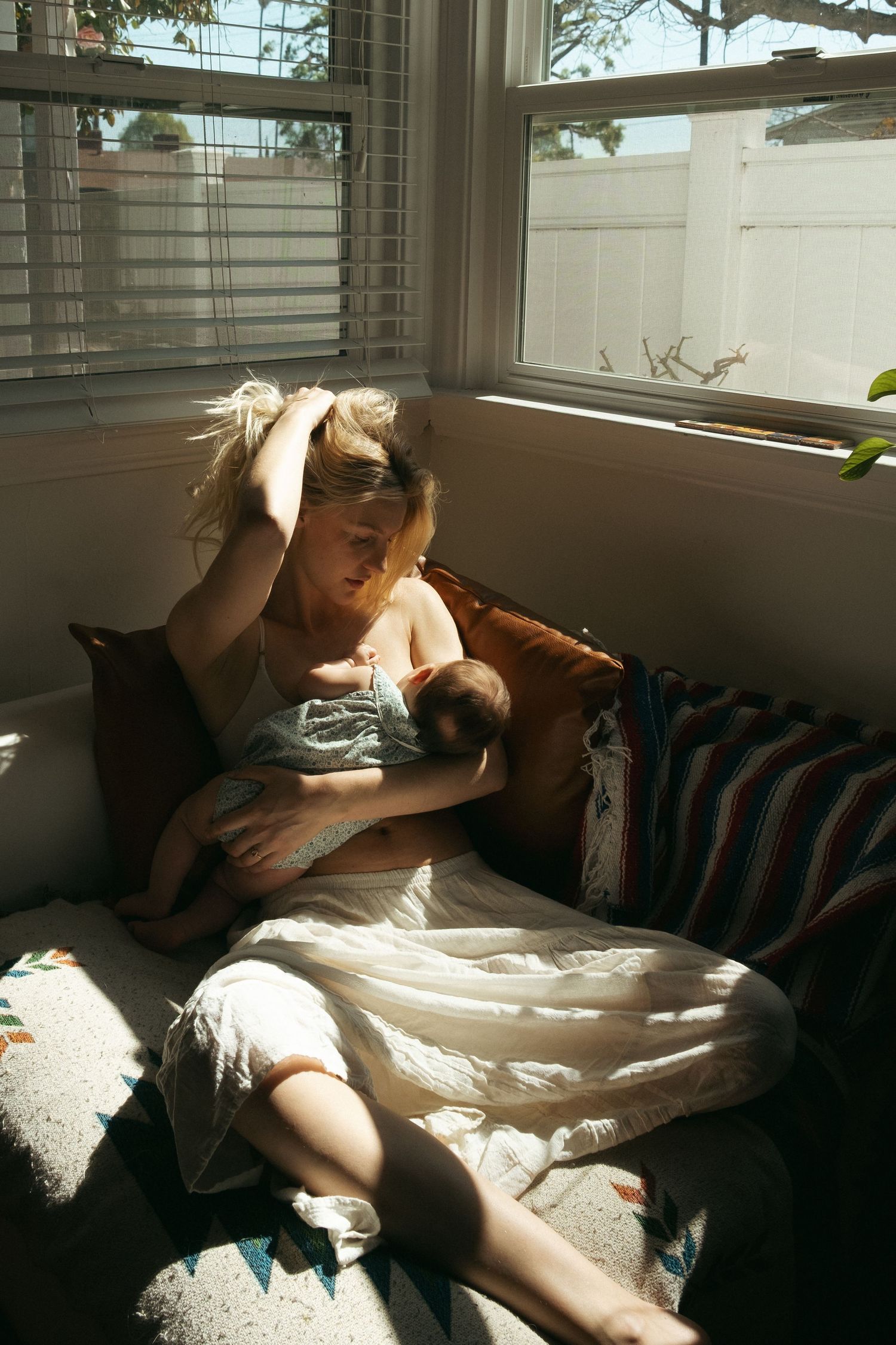 Peaceful moments captured in warm sunlight streaming through window blinds.