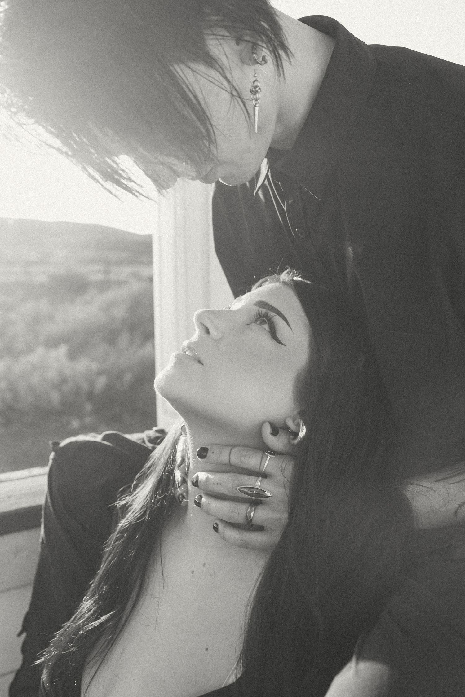 Romantic black and white photo sequence showing a couple in an intimate moment.