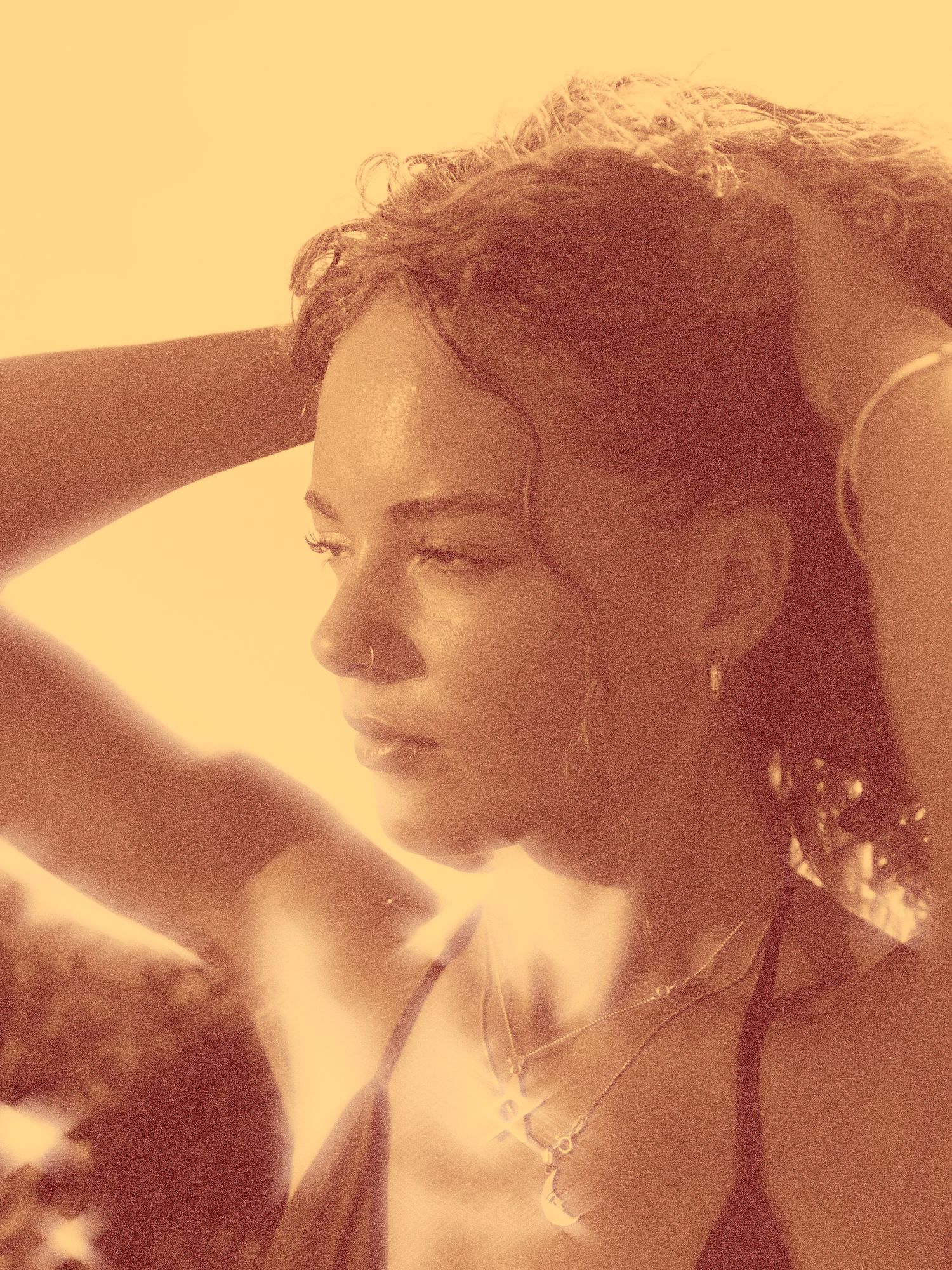 A series of sepia-toned profile portraits showing a woman in vintage style with curled hair against a warm background.