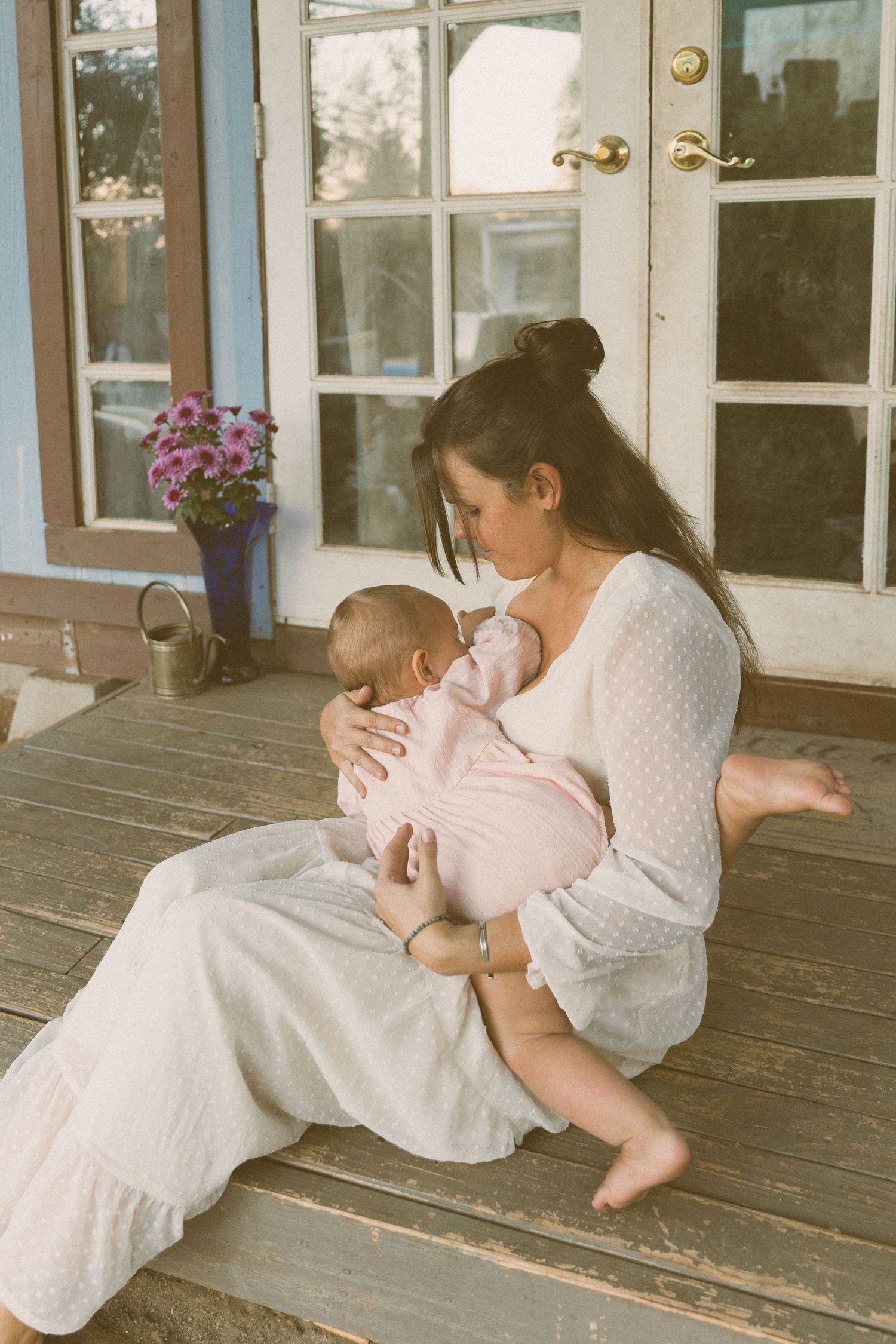 Vintage-style photos on a wooden porch with soft natural lighting.