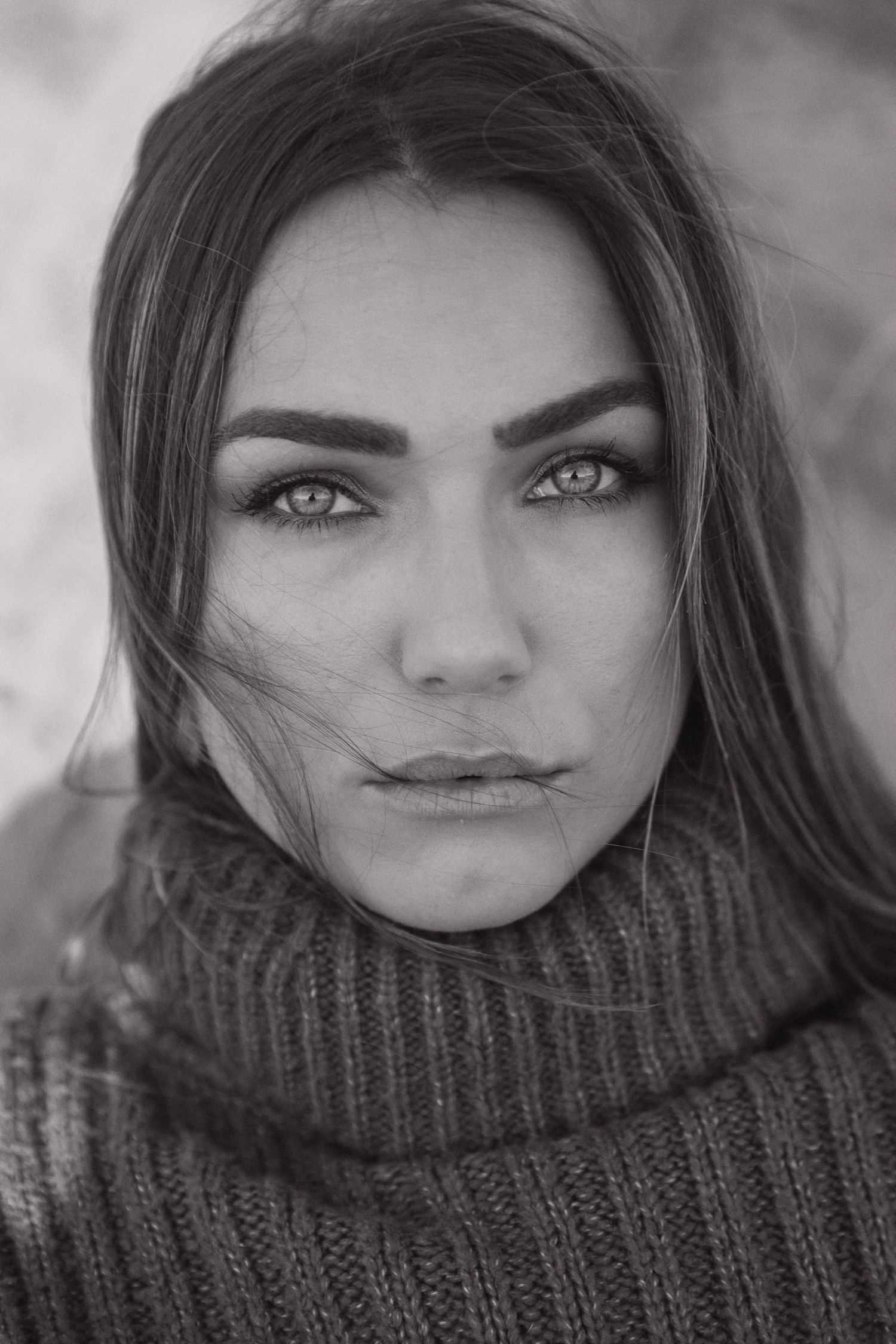 Black and white portrait with cozy knit turtleneck sweater.