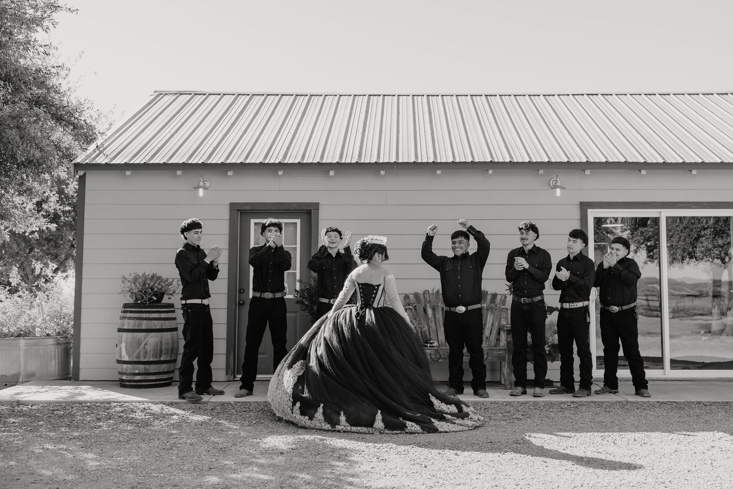 Quinceanera shares this sweet moment with her chambelanes during photo session with quince court before the ceremony and reception