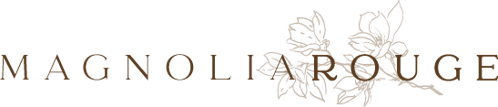 Magnolia Rouge logo featuring elegant serif typography with delicate floral magnolia branch illustration in brown tones.