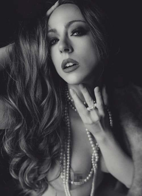 Dramatic black and white boudoir photography featuring pearl necklaces and glamorous styling in a film noir aesthetic.