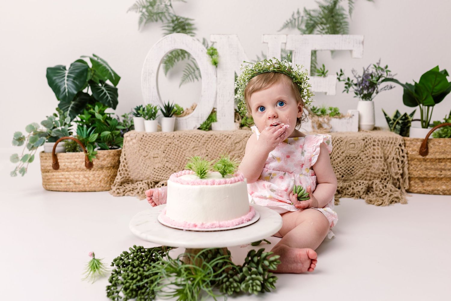 a plant lovers cake smash themed photo shoot for baby's first birthday in cedar park texas.