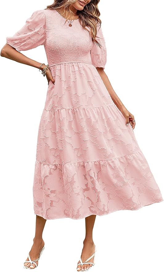 Pink floral lace midi dress with puff sleeves, tiered skirt, and smocked bodice paired with white strappy sandals.