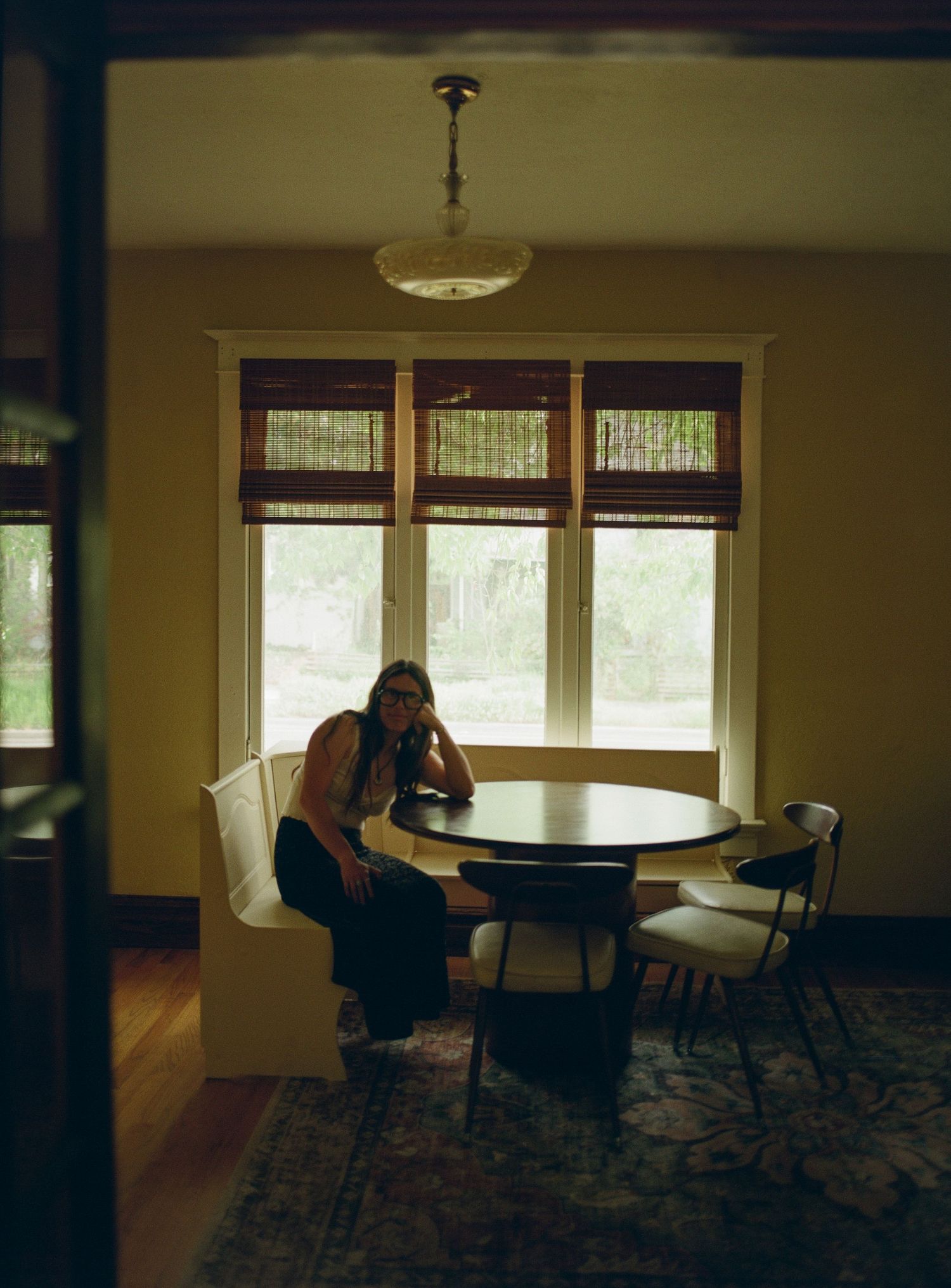 Environmental portrait photographed on medium format film inside a historic Salt Lake City, Utah home.