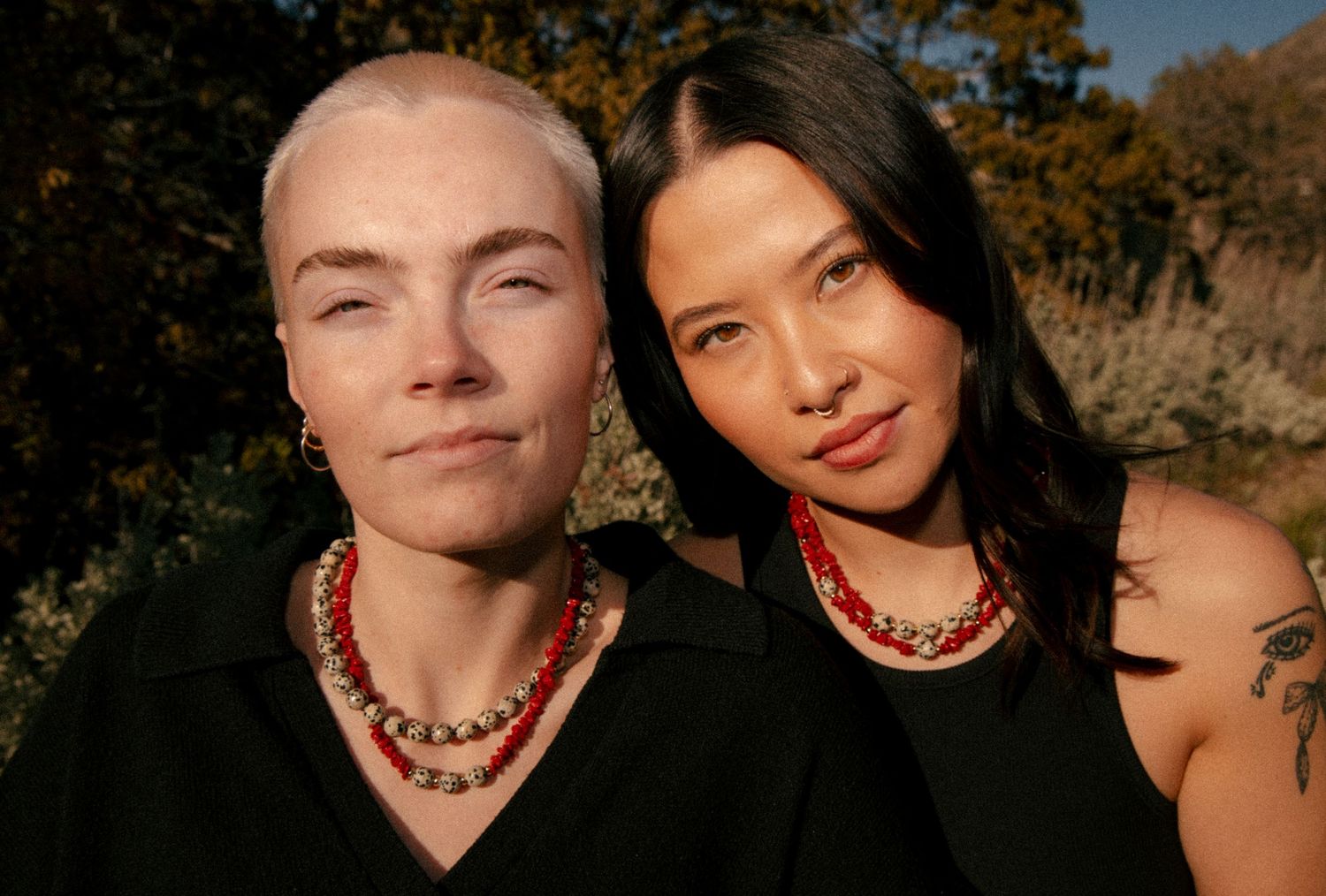 Creative couples portrait featuring handmade jewelry in warm sunlight in Salt Lake City, Utah.
