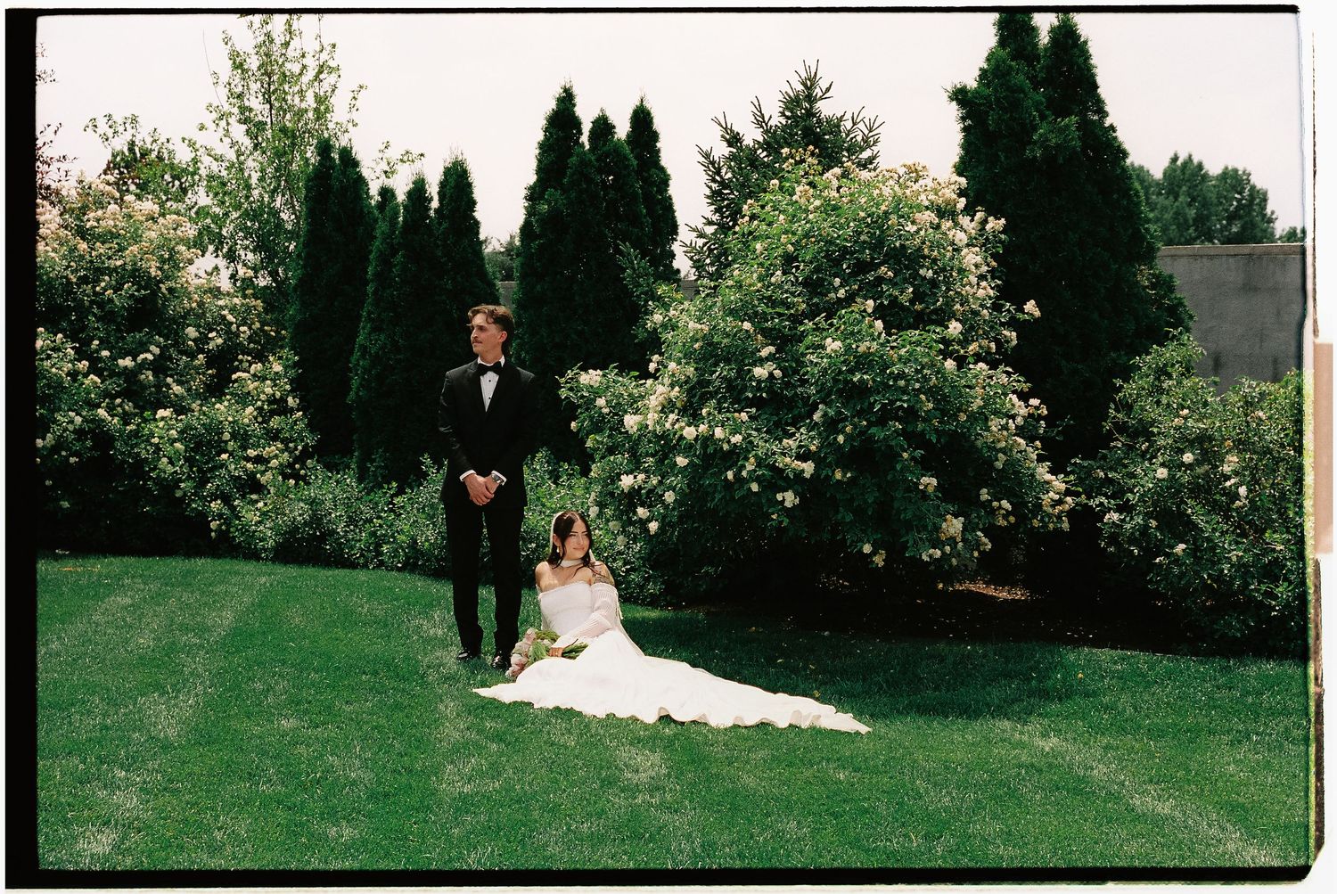 Bride and groom in a garden photographed on film at their Utah wedding.