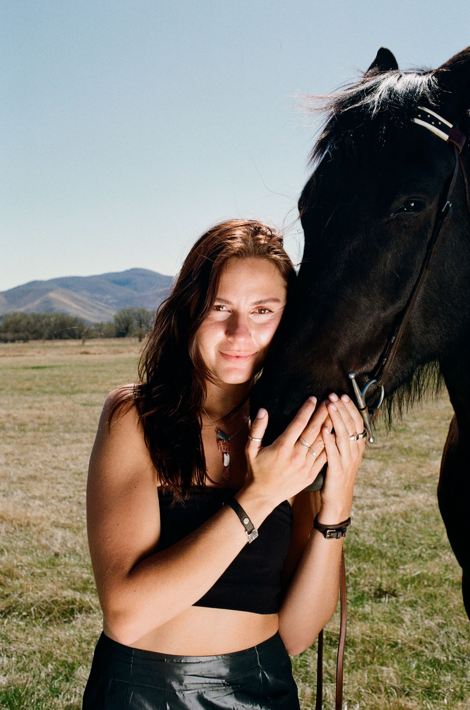 35mm film portrait of a woman with a horse in the Utah landscape.