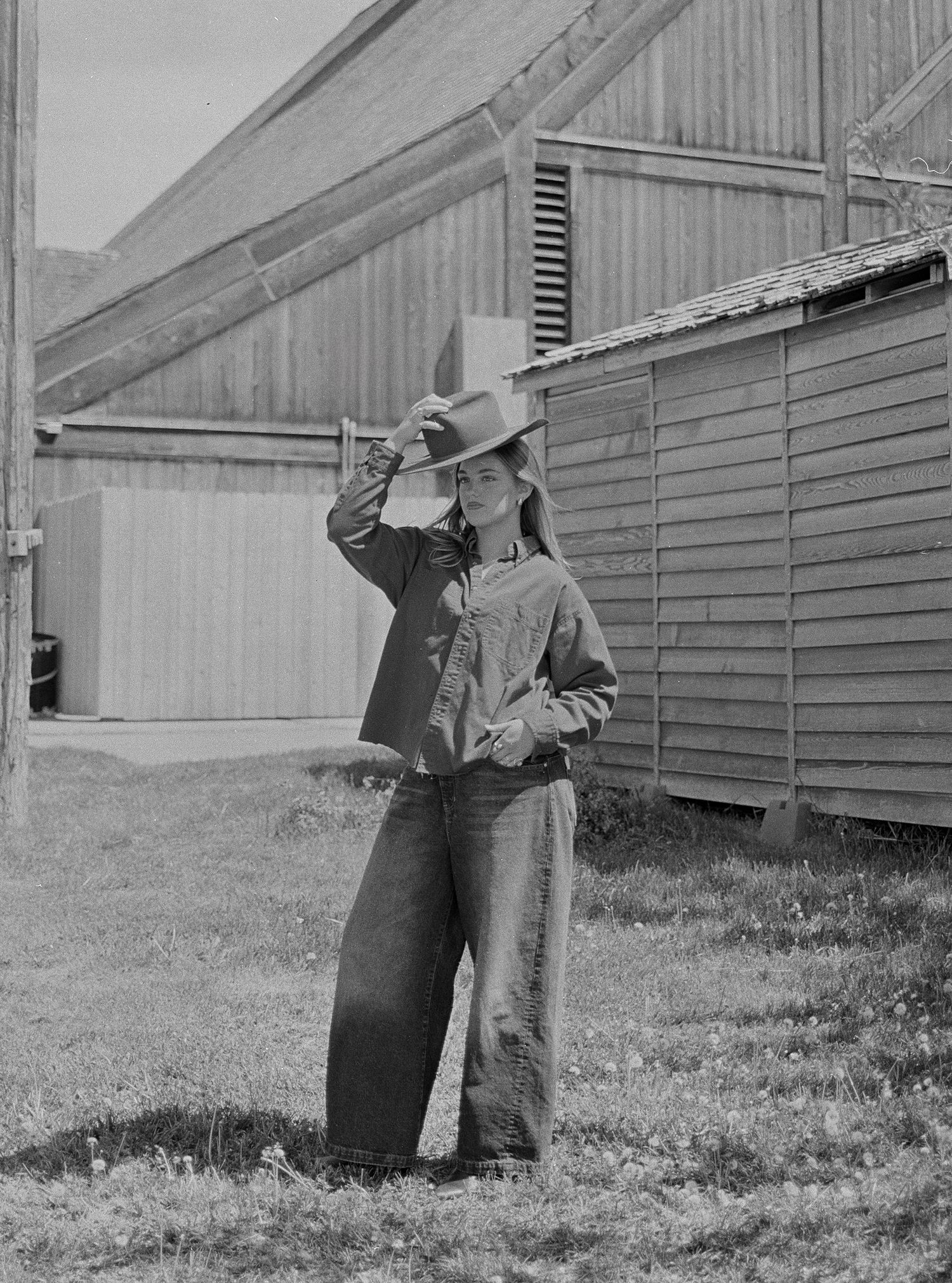 Black and white 35mm film western portrait of a woman in a cowboy hat in Utah.