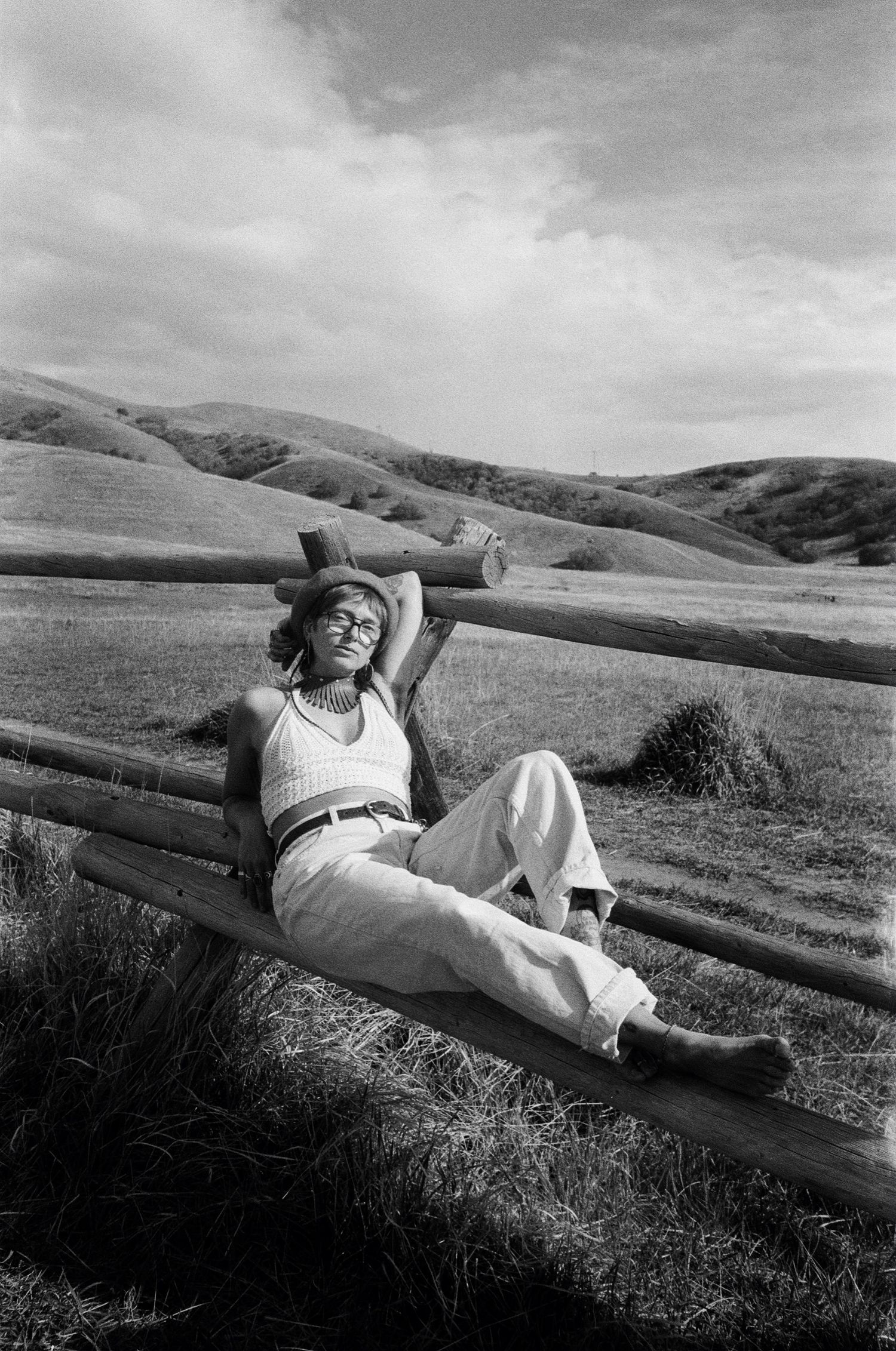 Black and white 35mm film portrait in the rolling hills of Utah.