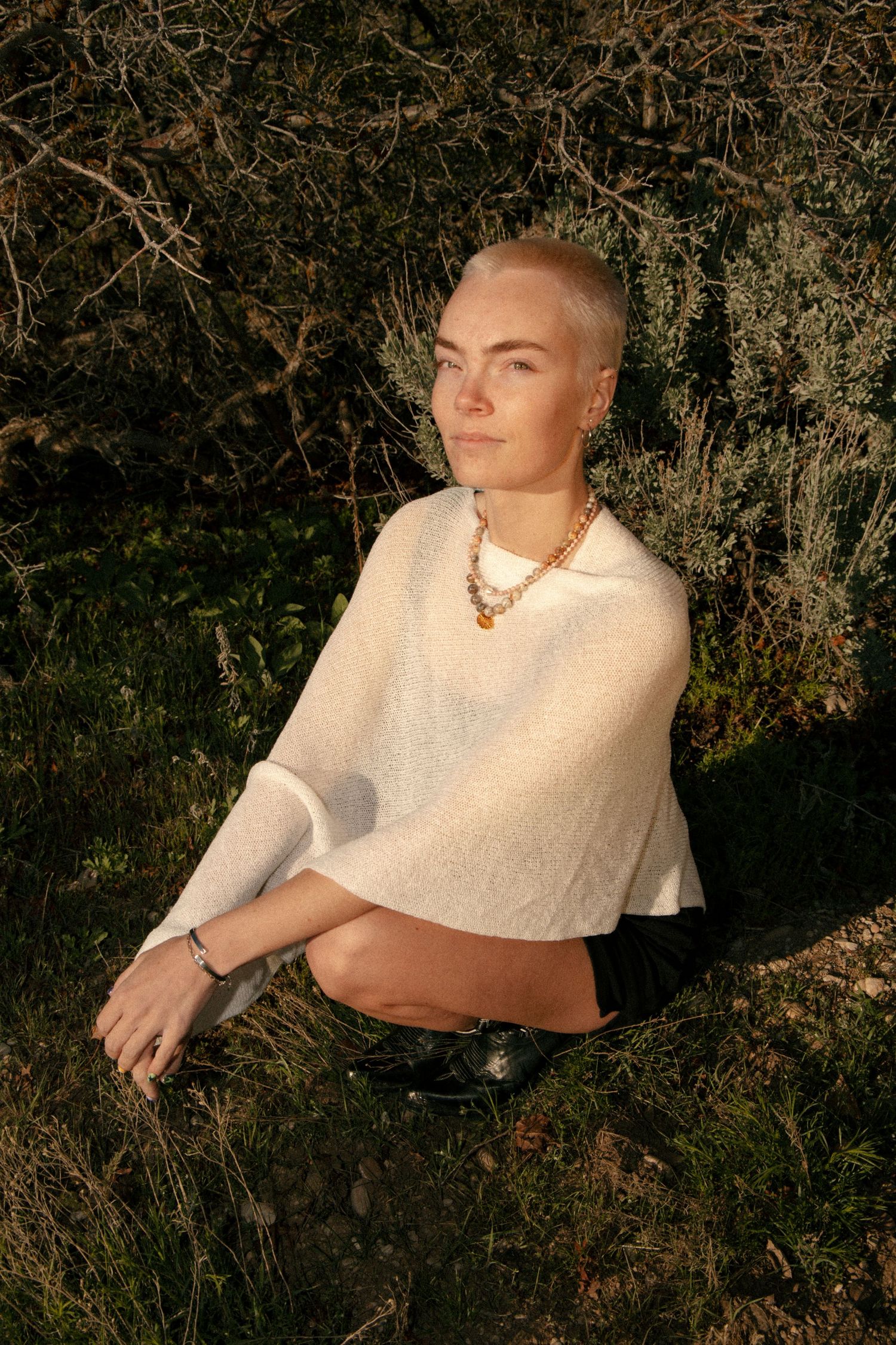 Outdoor portrait featuring handmade jewelry in warm evening light in Salt Lake City, Utah.