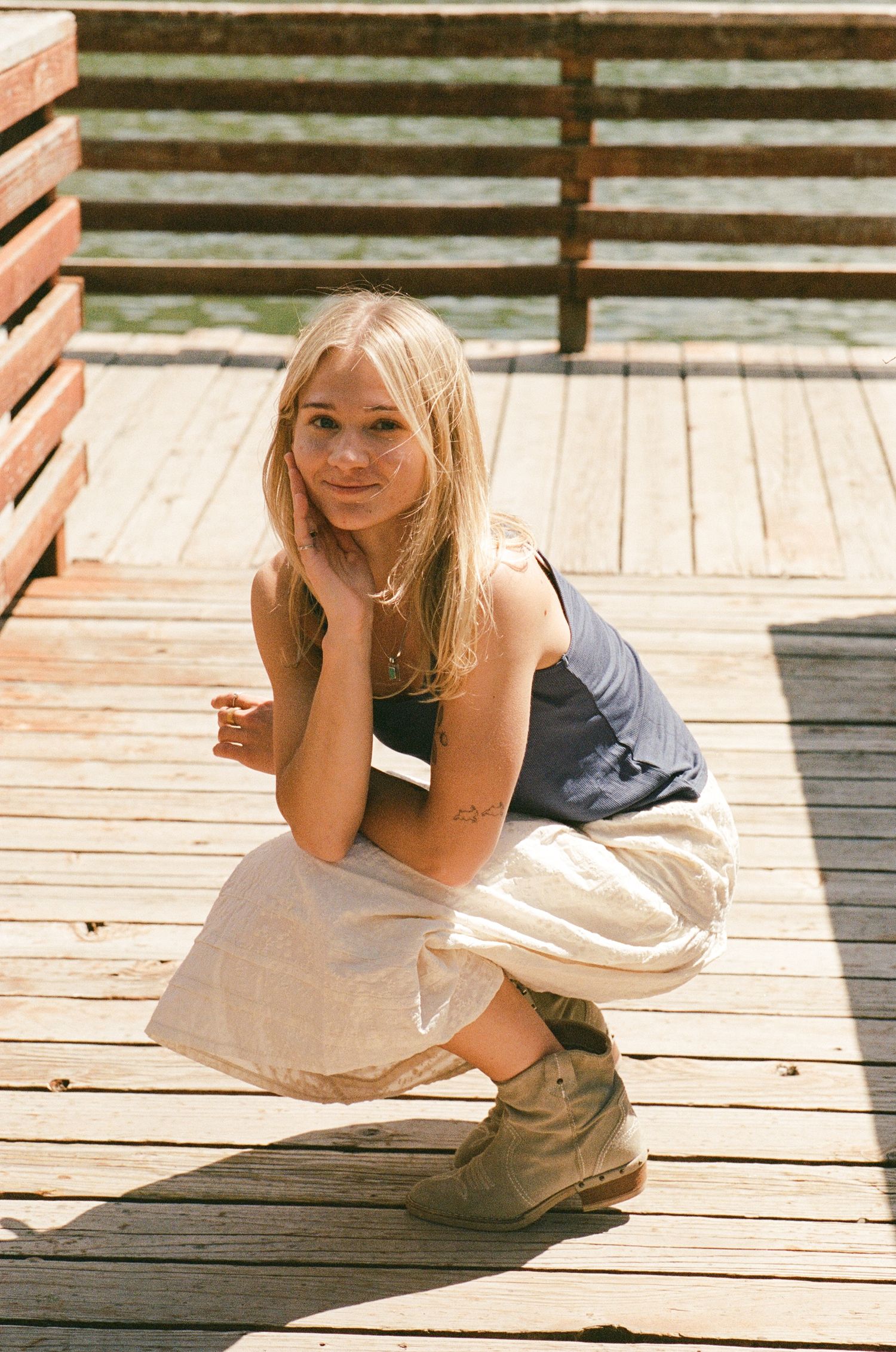 35mm film portrait of a woman in western-inspired clothing outdoors in Utah.