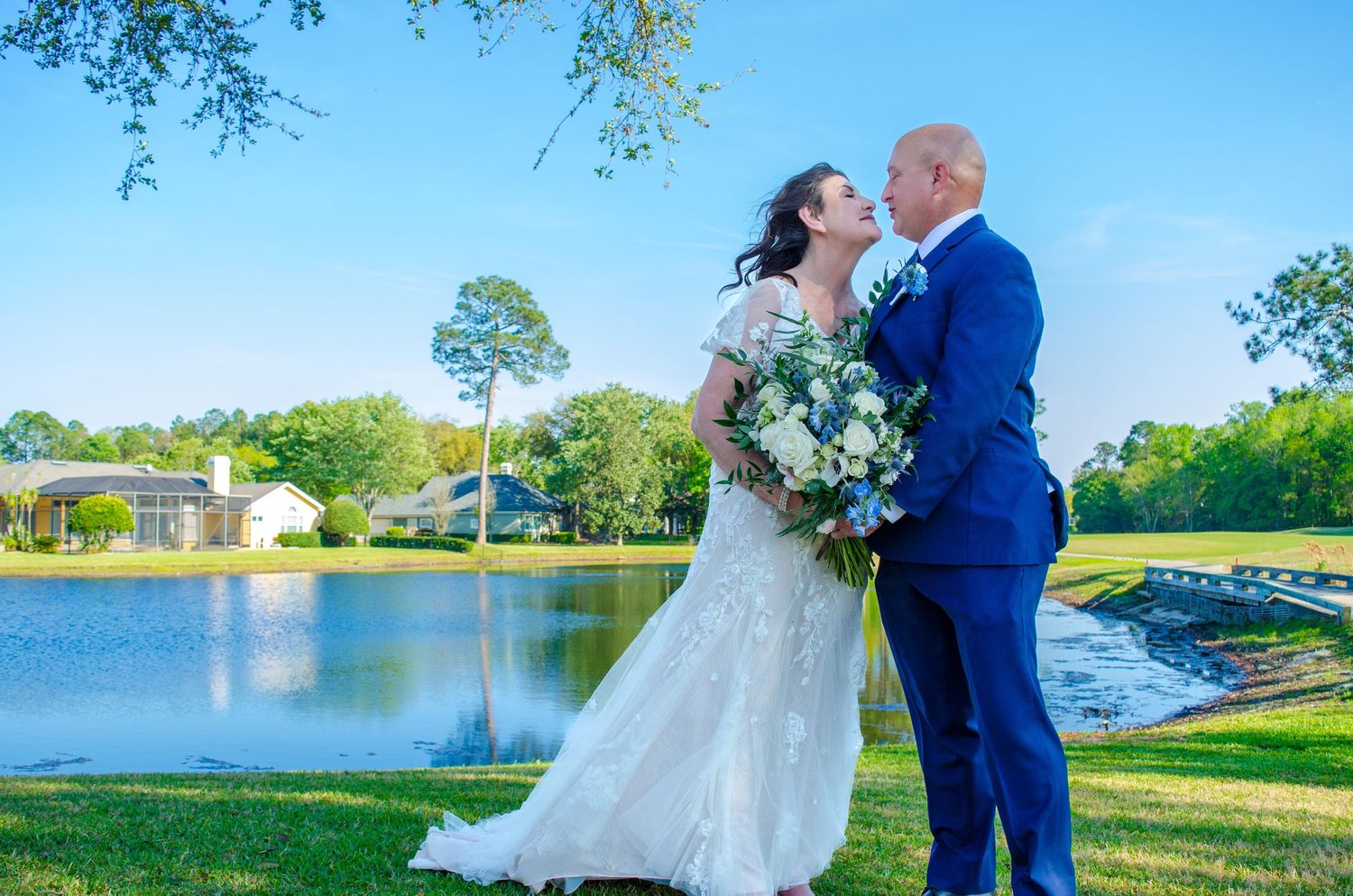 Bride and Groom share an intimate moment during their formal photos at DeerCreek Country Club.