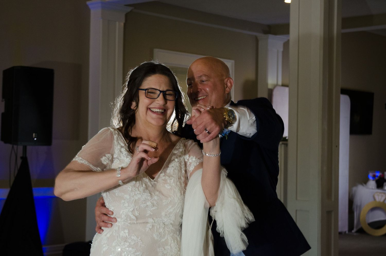 Bride and Groom share a laugh as they have fun during their first dance.