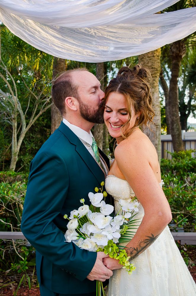 The couple sharing a kiss