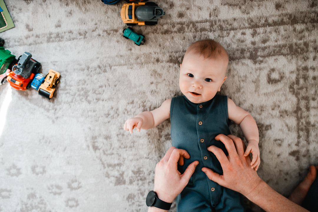 Lifestyle in-home family photography capturing real moments in an Omaha home.