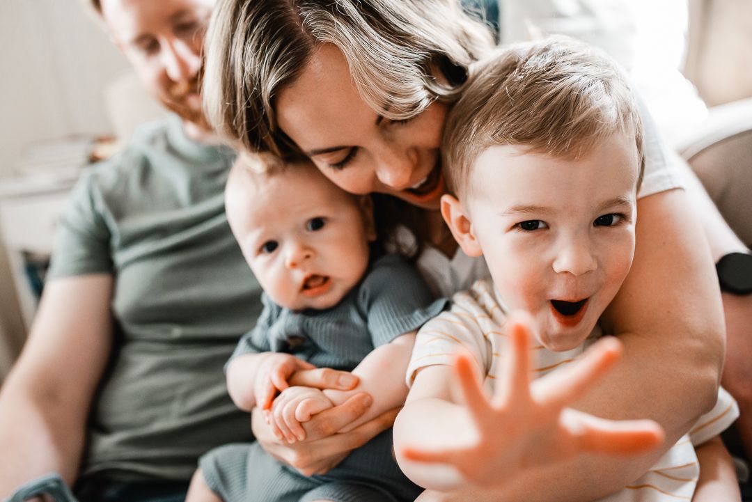 Lifestyle in-home family photography capturing real moments in an Omaha home.