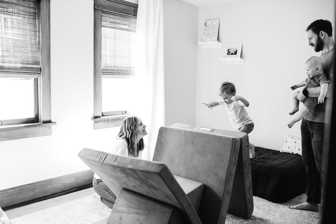 Lifestyle in-home family photography capturing real moments in an Omaha home.