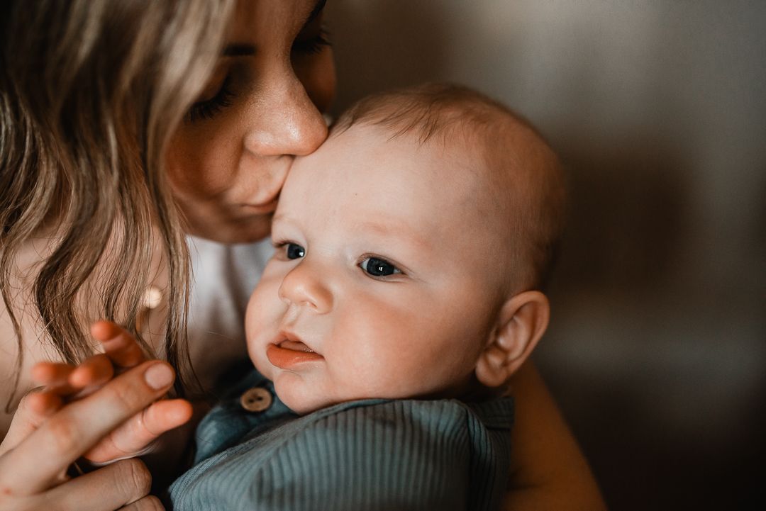 Lifestyle in-home family photography capturing real moments in an Omaha home.