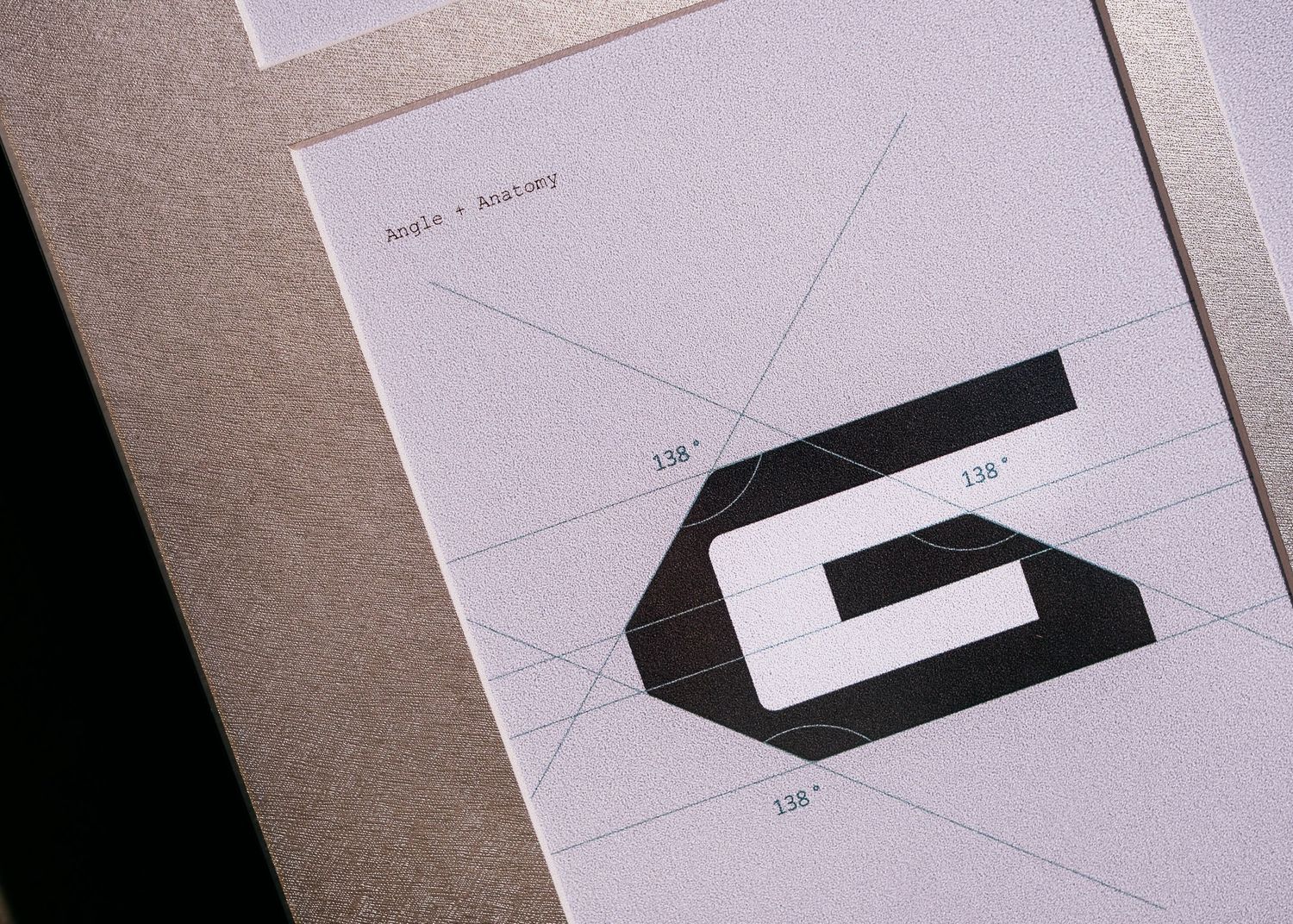 Logo design anatomy sheet showing a bold letter G with geometric angle guidelines marked at 138 degrees.