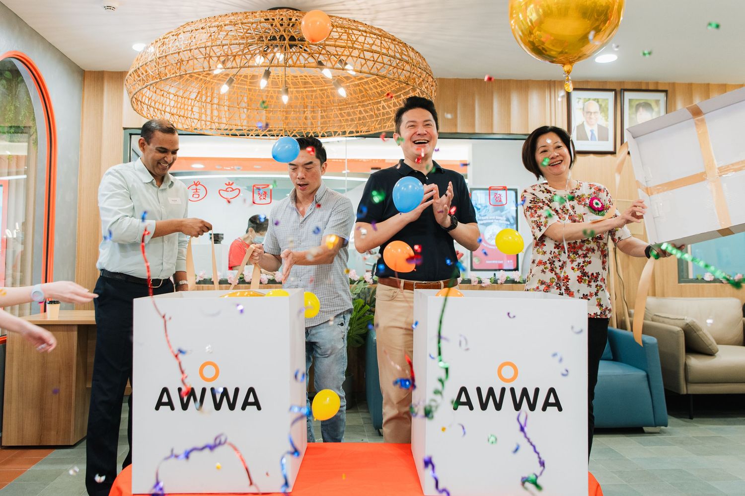 Bright interior space with orange dome lighting and AWWA branding.