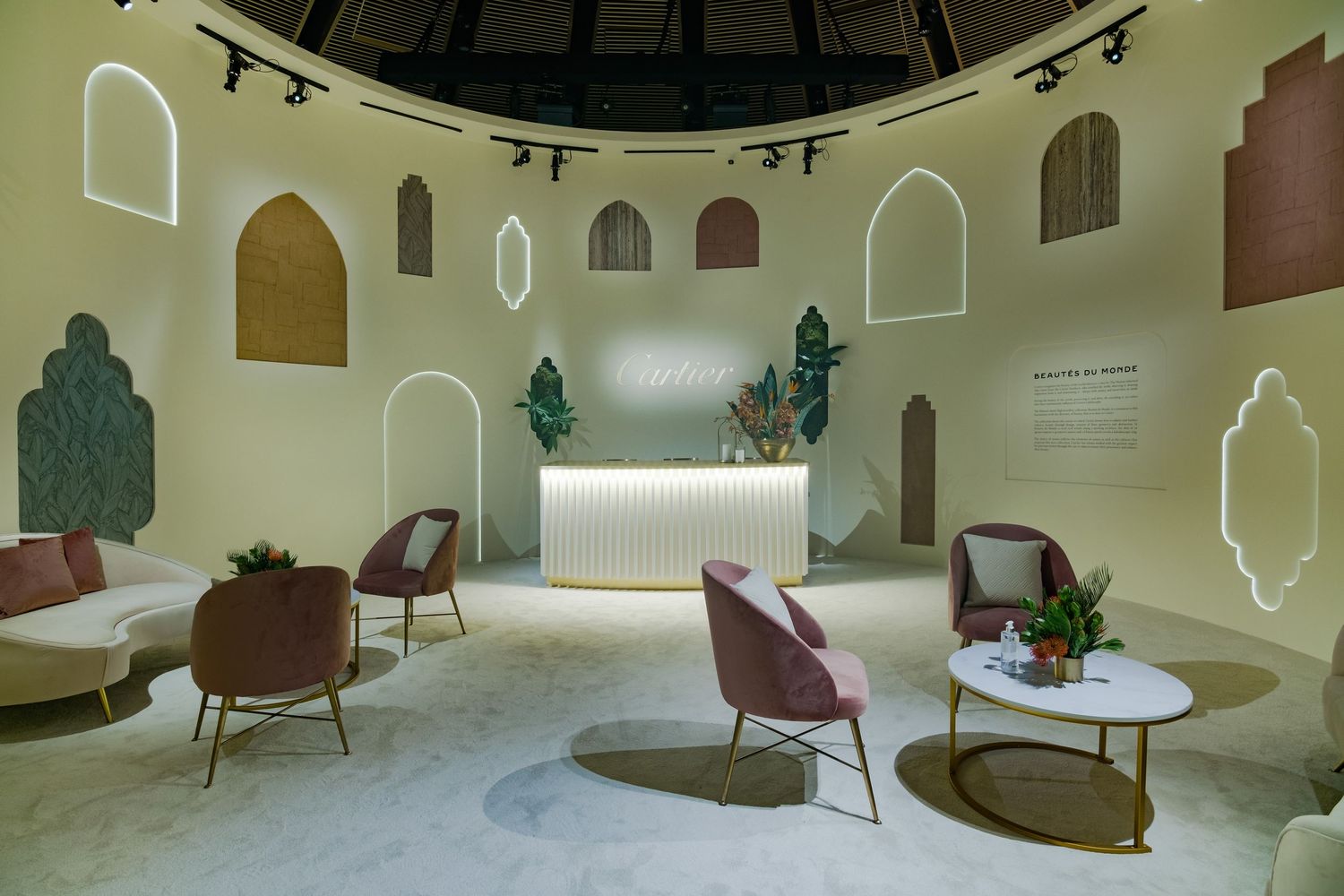 Curved architectural space with arched windows and modern seating arrangements.