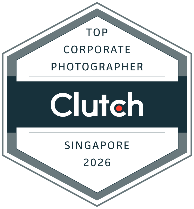 A collection of hexagonal corporate award badges in gray and white arranged in a row.