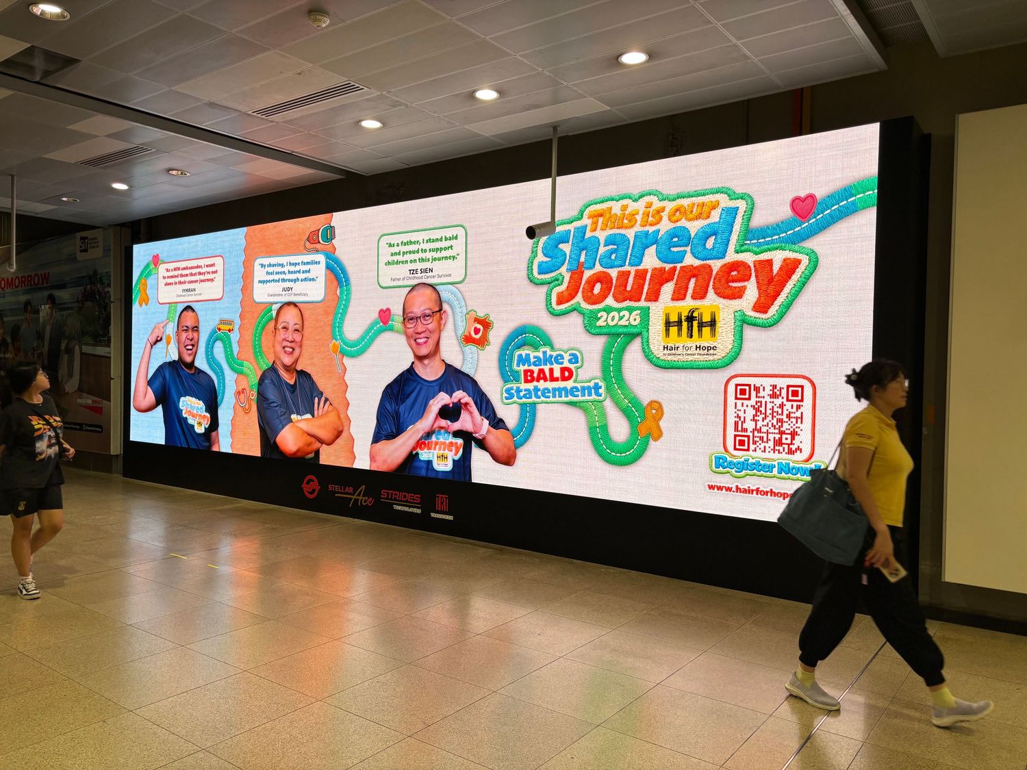 MRT display advertisement featuring PixelMusica Portrait Photography, promoting Children's Cancer Foundation, Hair For Hope event.