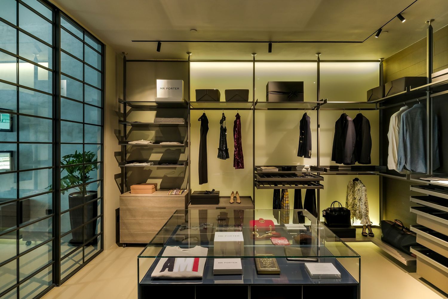 PixelMusica - Interior Photography - Madison Group - Modern retail showroom with minimalist shelving and glass wall displays.