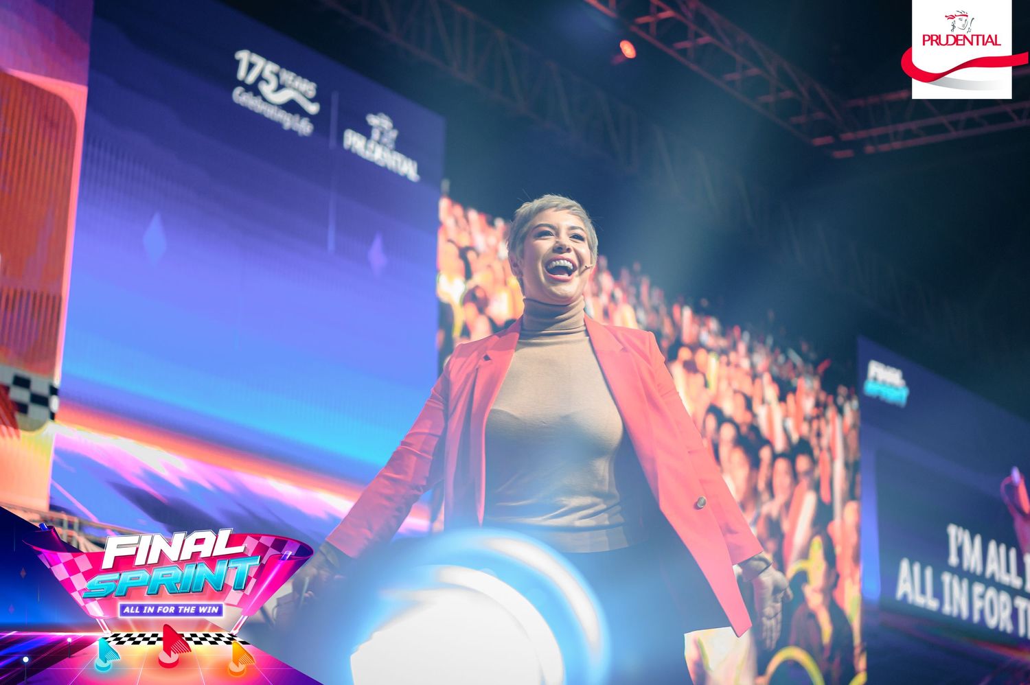 PixelMusica - B2B Corporate Event Photography - Prudential -  Dramatic stage lighting with colorful effects at indoor event venue.