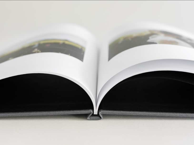Close up of the open book to showcase that the pages do NOT lay flat when the book is open.