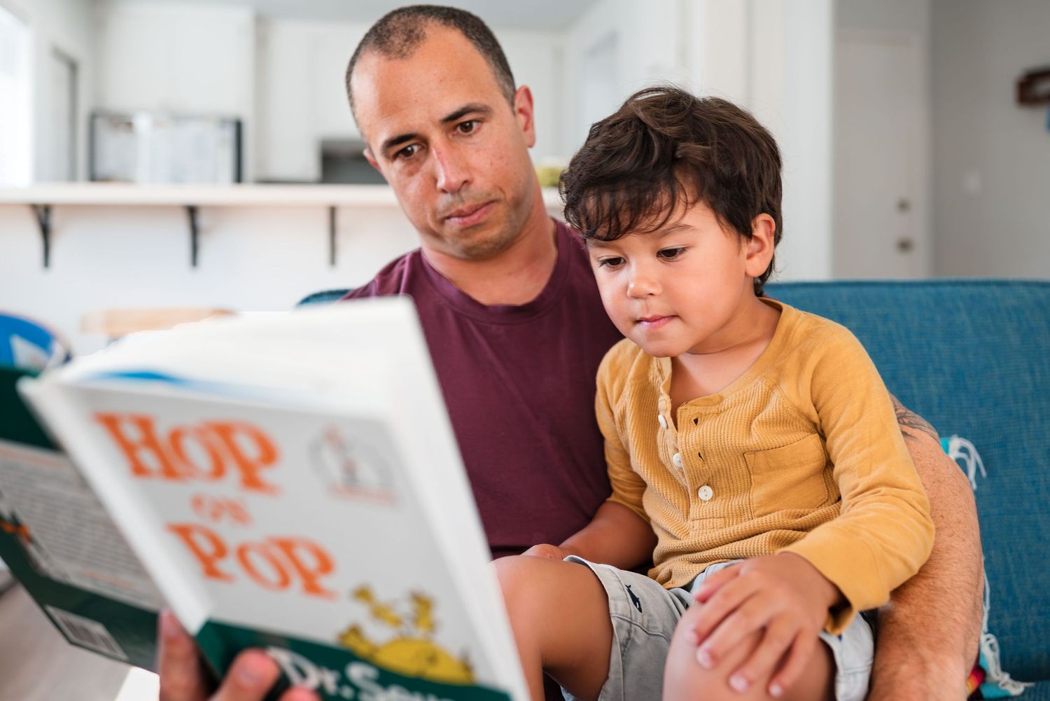 Father and child reading together