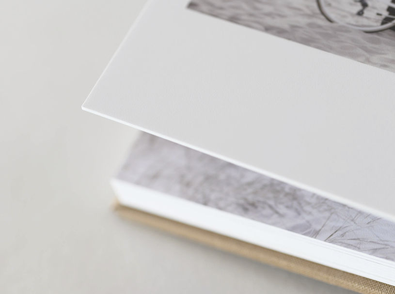 Close up of corner of lay flat album. Shows page thickness and durability of product.