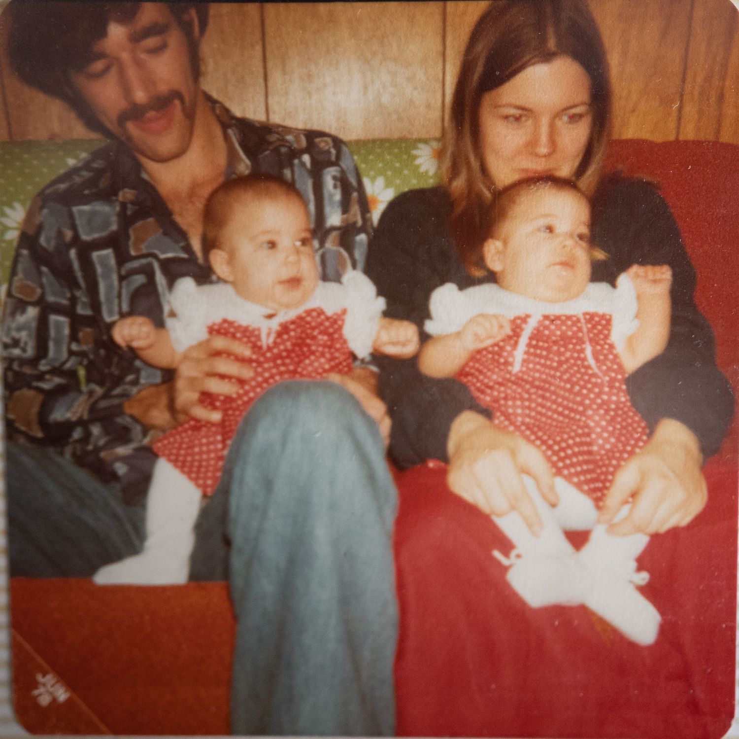 Family snapshot from the 70s. Photographer and sister as infants sitting in parents laps. About Me. Doughman Photography
