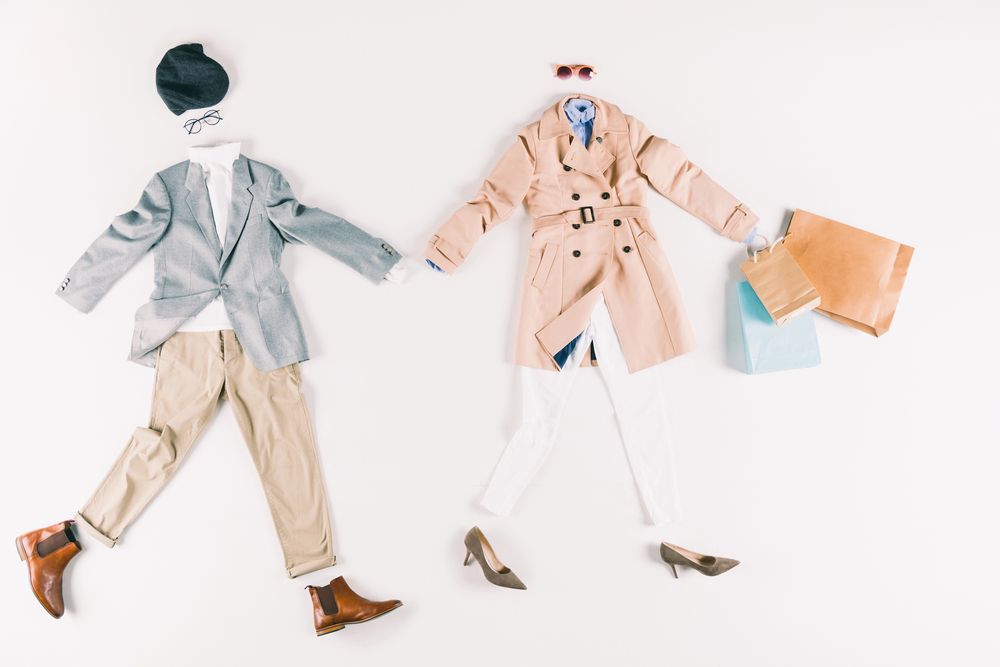 Flat lay of a man and woman's coordinating outfits.  