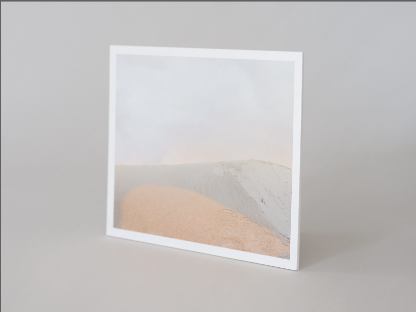 Image of a white gallery board shown at a slight angle to show how thin yet durable product is.
