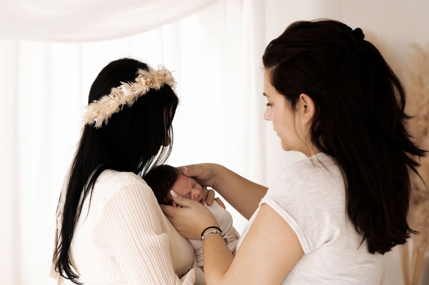 A series of images showing a hairstylist styling dark hair into an elegant updo for a formal occasion.