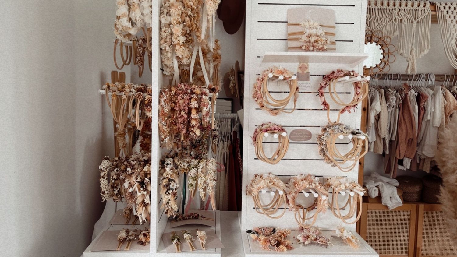 A collection of ornate antique chandeliers and light fixtures displayed in a vintage store or showroom.