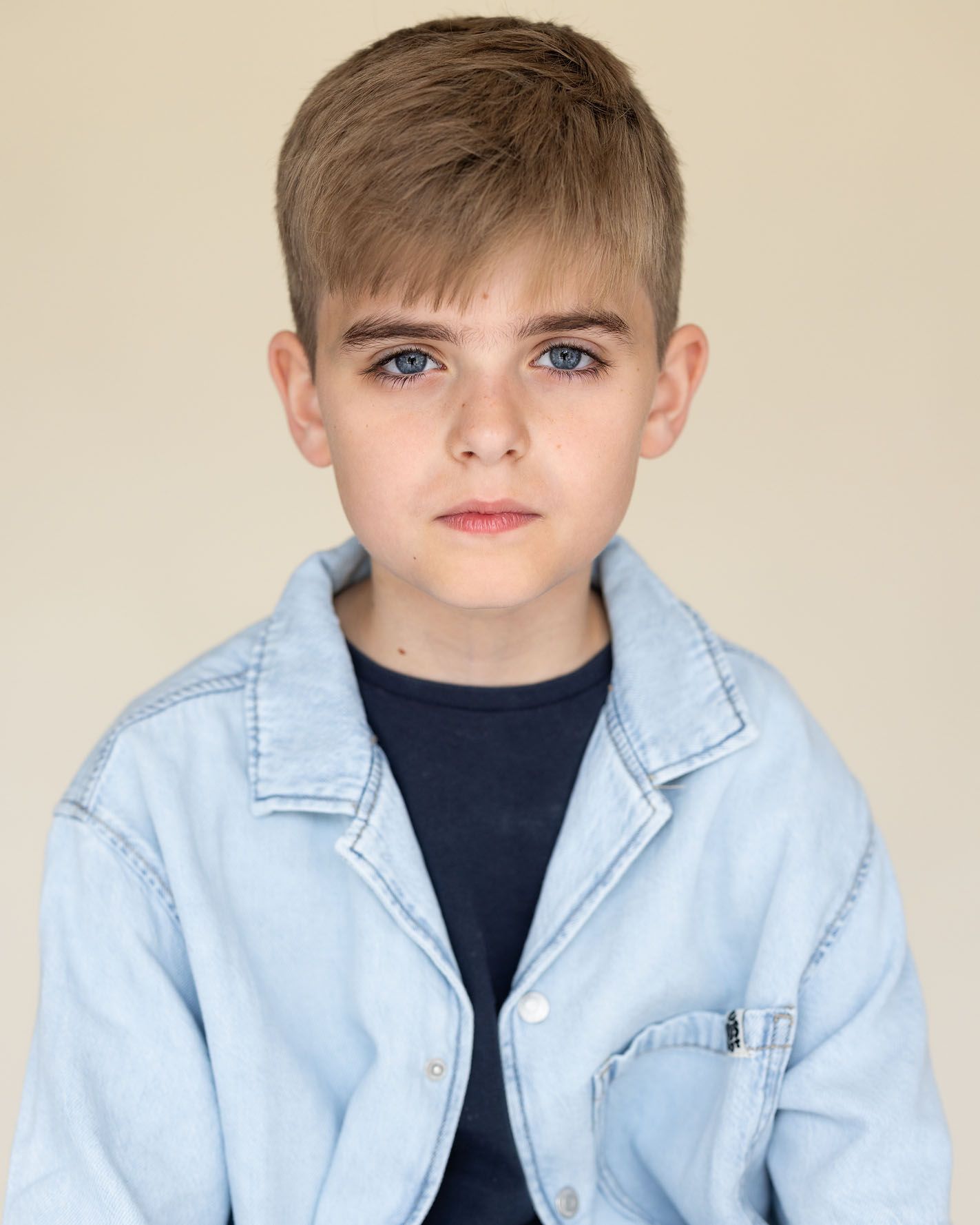 Young boy in blue denim jacket:
Actor headshot of a young boy photographed at Abigail Stewart Photography studio in the Home Counties