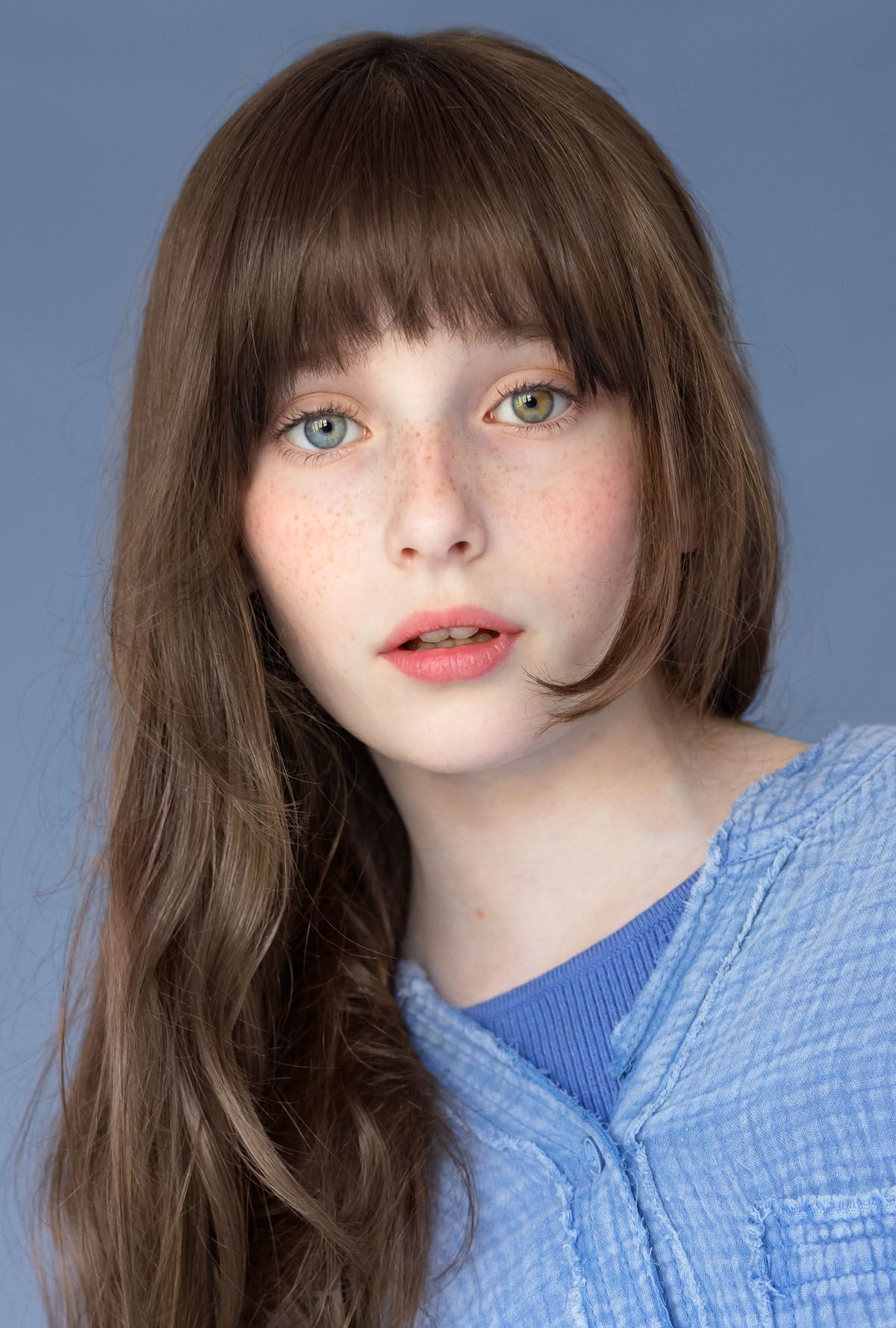 Young girl in blue top:
Actor headshot of a young girl photographed by Abigail Stewart Photography near Milton Keynes