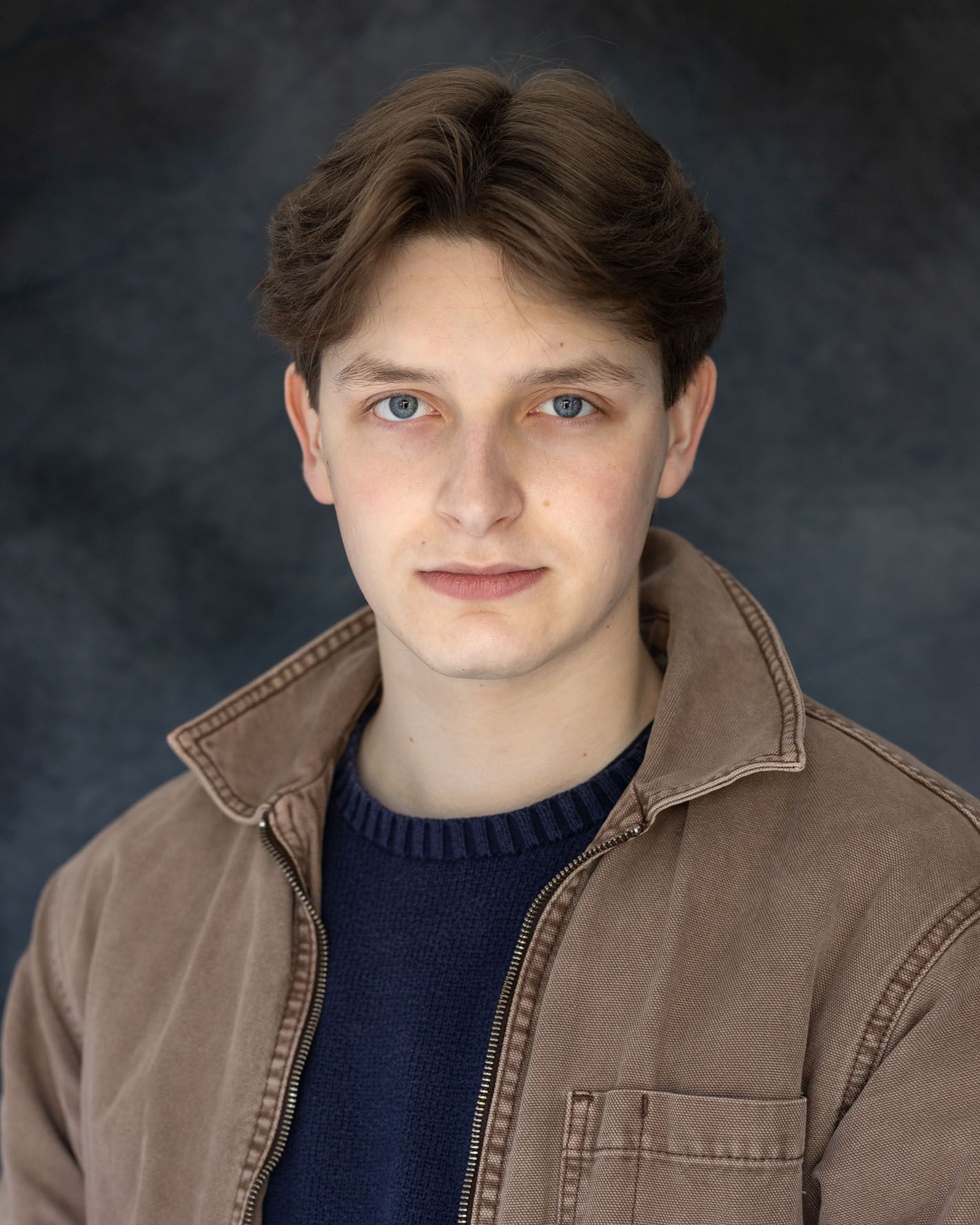 Young man in brown jacket: Spotlight images taken in Abigail Stewart's photography studio near Milton Keynes, Buckinghamshire