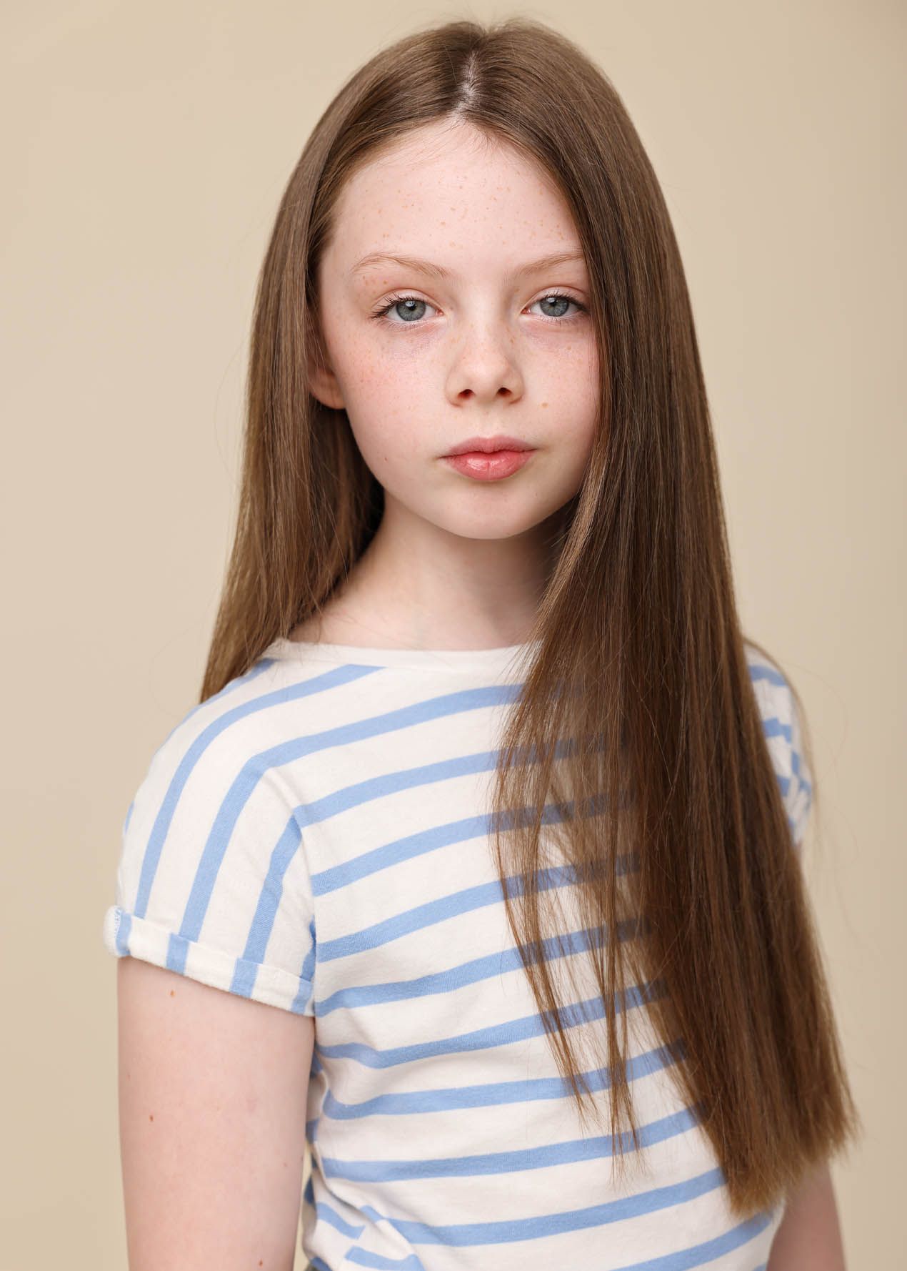 Young girl in striped top, half length:
Actor headshot of a young woman in a striped top, photographed at Abigail Stewart Photography studio