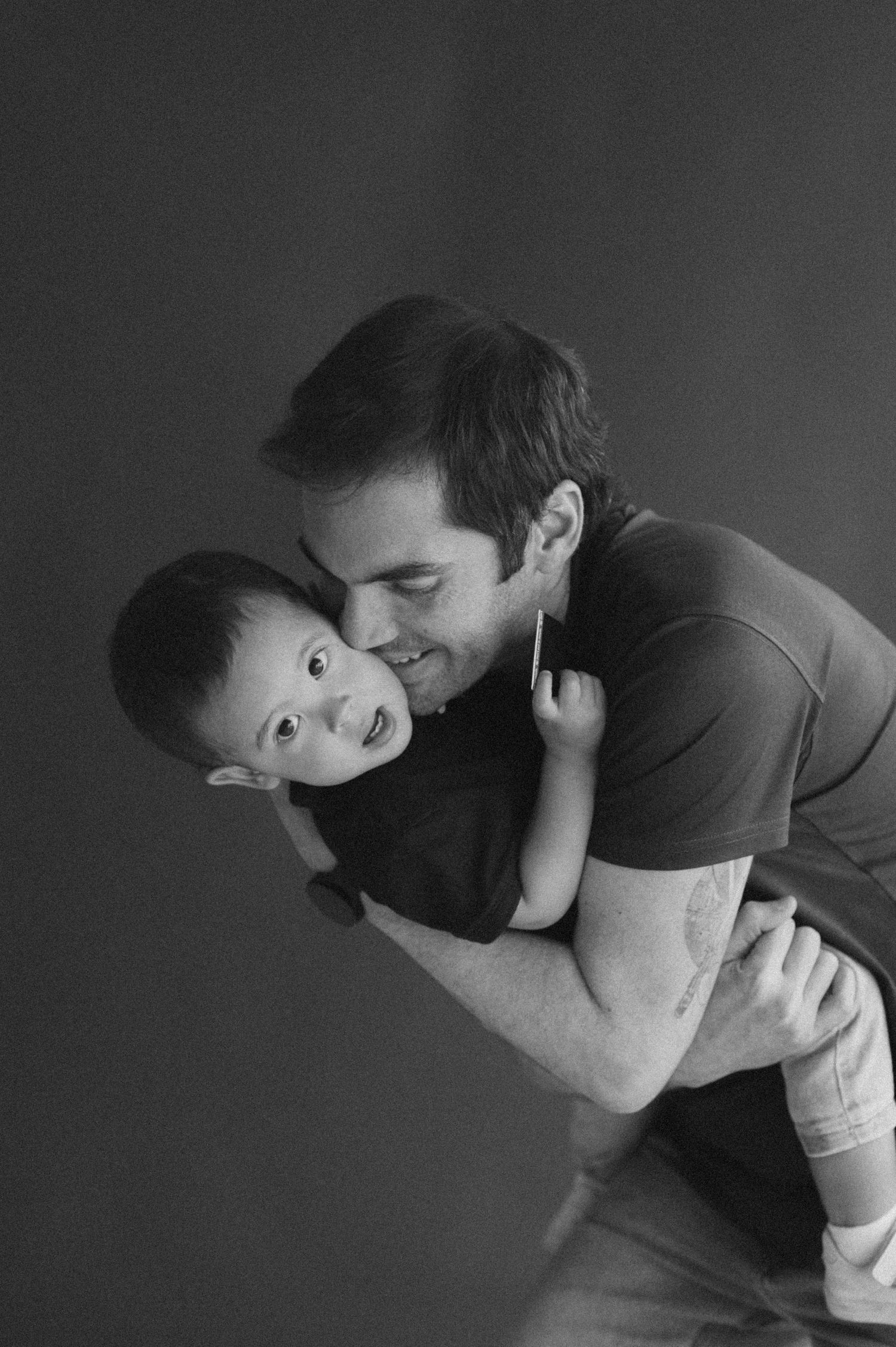 Sweet black and white portrait of playful bonding moment.