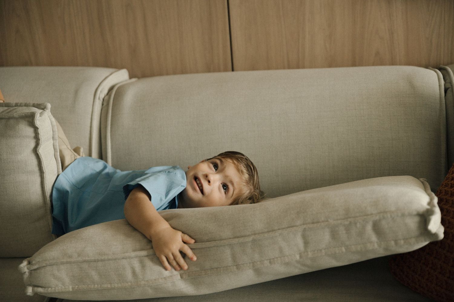 A series of images showing a light gray couch in a neutral toned room.