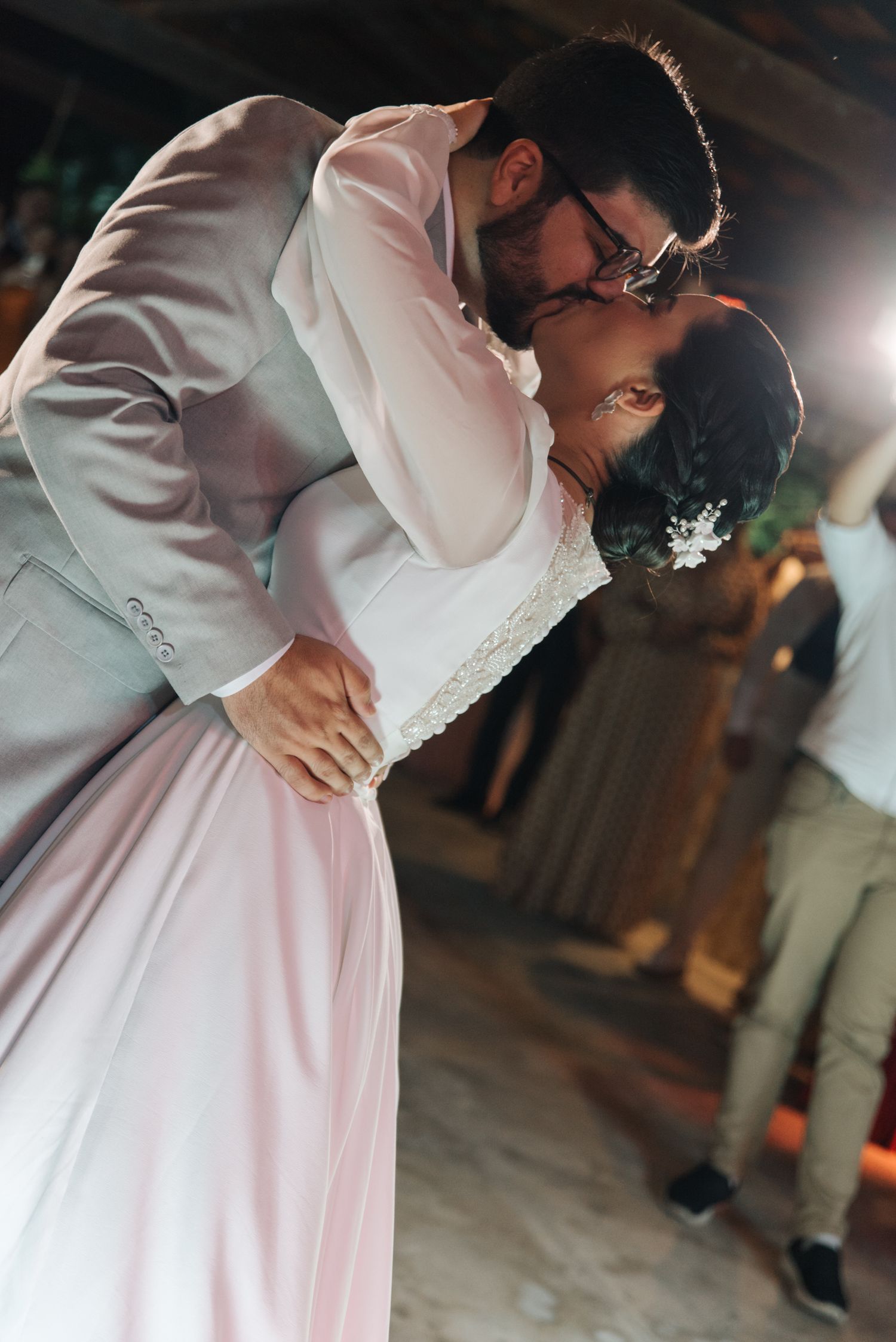 A tender dance moment between newlyweds during their wedding reception.