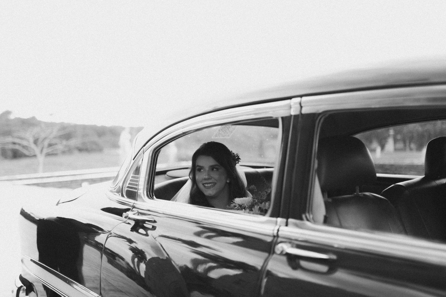 Black and white photo sequence shows someone driving a car while expressing different emotions through gestures.